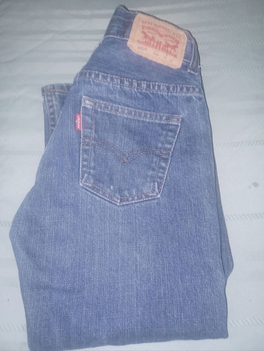 Four pairs of boys Levi jeans size 8R